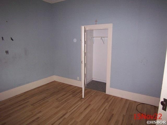 unfurnished bedroom featuring dark hardwood / wood-style flooring