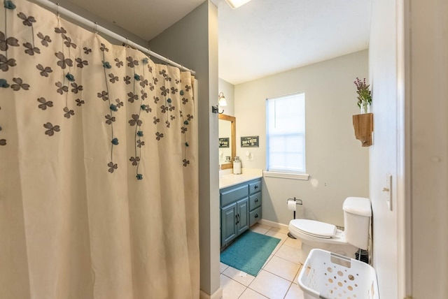 bathroom featuring vanity, toilet, and tile patterned floors