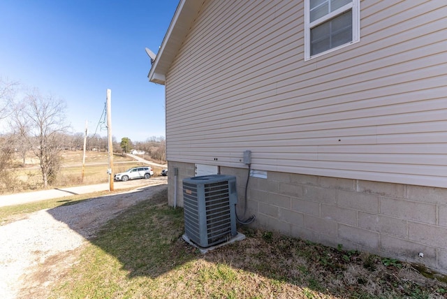 view of property exterior with central AC