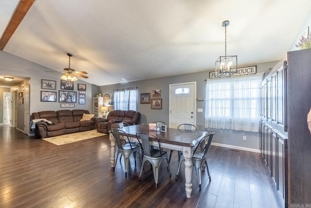 dining area with lofted ceiling, dark hardwood / wood-style floors, and ceiling fan with notable chandelier