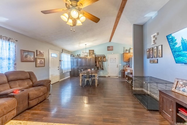 living room with dark hardwood / wood-style flooring, ceiling fan, and lofted ceiling