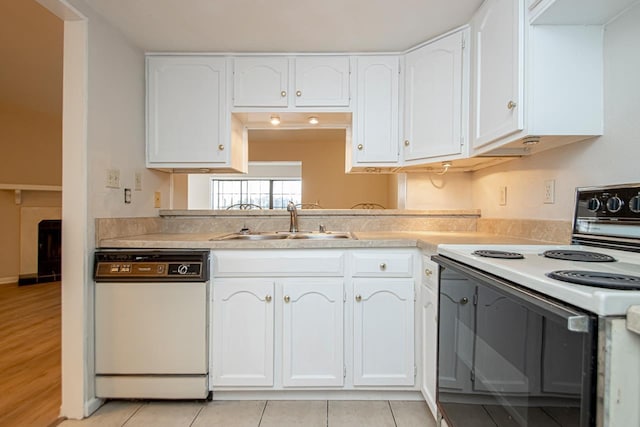 kitchen featuring sink, white cabinetry, white dishwasher, and electric range oven