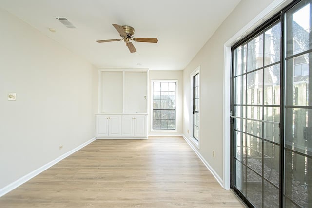 unfurnished room featuring light hardwood / wood-style floors and ceiling fan