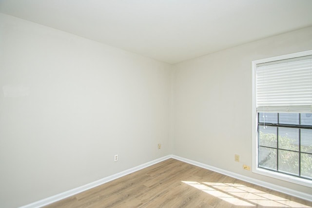 unfurnished room with light hardwood / wood-style floors