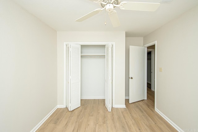 unfurnished bedroom with light hardwood / wood-style flooring, ceiling fan, and a closet