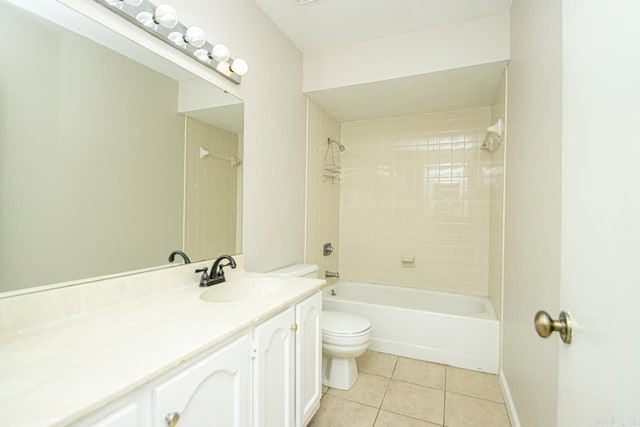 full bathroom with tile patterned floors, vanity, toilet, and tiled shower / bath