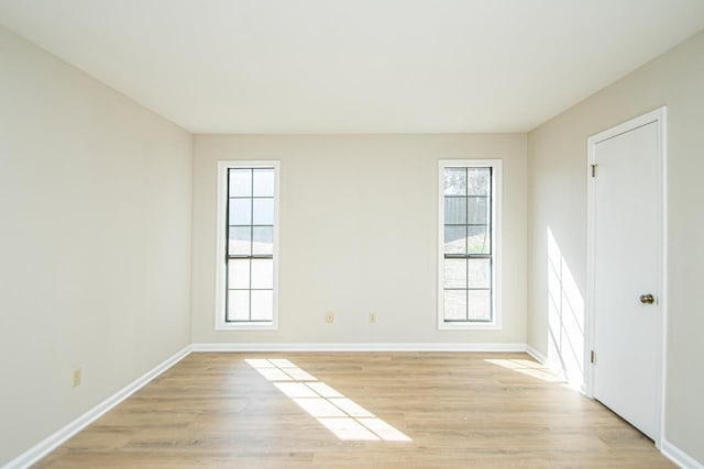 empty room with light hardwood / wood-style floors