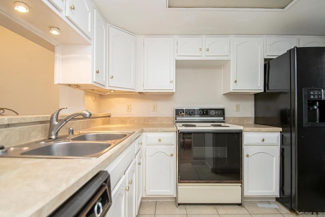 kitchen with electric range oven, white cabinetry, and black fridge with ice dispenser