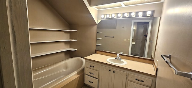 bathroom featuring a tub to relax in and vanity