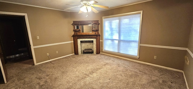 unfurnished living room featuring ceiling fan, carpet floors, ornamental molding, and a fireplace