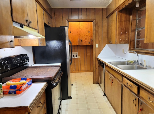 kitchen with sink, black electric range oven, dishwasher, and wooden walls