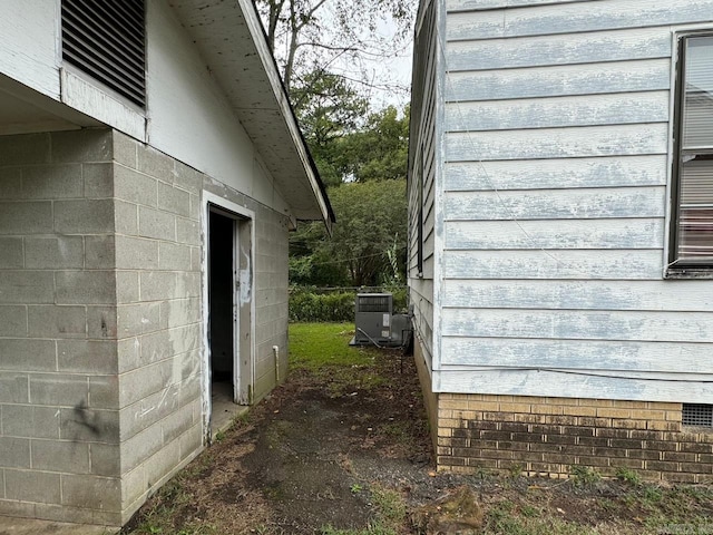 view of side of property with cooling unit