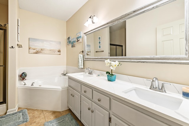 bathroom featuring independent shower and bath, tile patterned flooring, and vanity