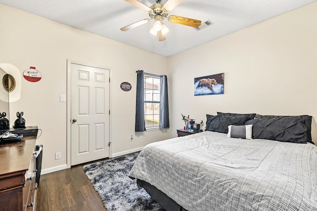 bedroom featuring ceiling fan and dark hardwood / wood-style flooring