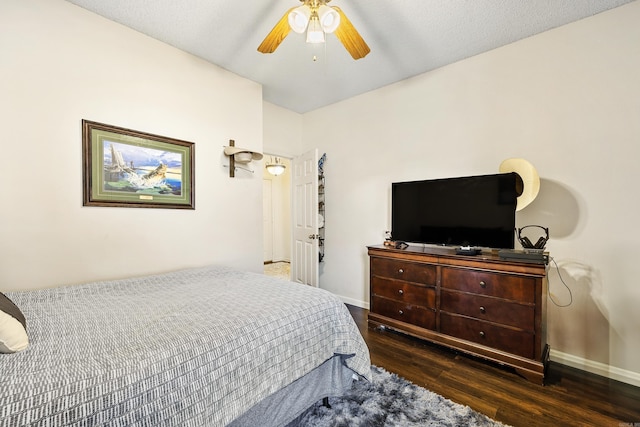 bedroom with dark wood-type flooring and ceiling fan