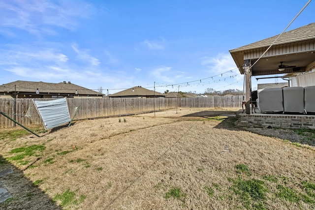 view of yard featuring ceiling fan