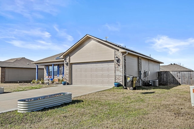 view of side of property with a garage, a lawn, and central air condition unit