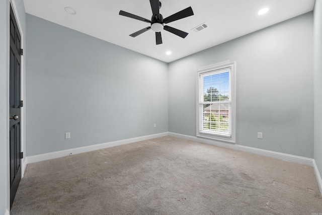 unfurnished room featuring ceiling fan and carpet floors