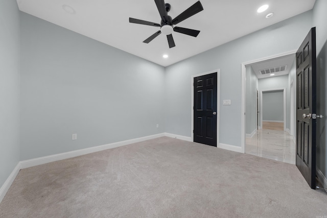 unfurnished bedroom featuring ceiling fan and light colored carpet