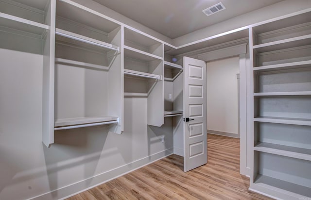 walk in closet featuring light hardwood / wood-style floors