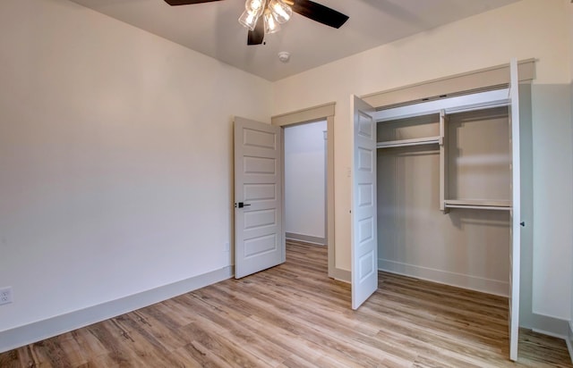 unfurnished bedroom with ceiling fan, a closet, and light hardwood / wood-style floors