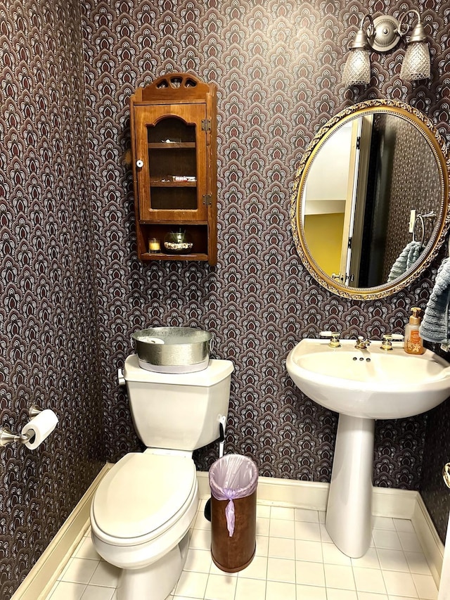 bathroom with tile patterned floors, toilet, and sink