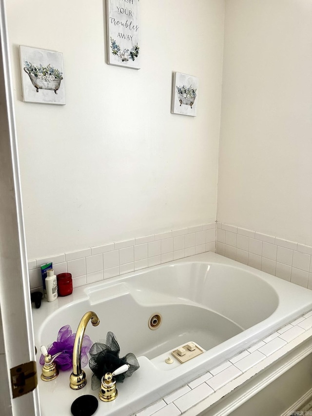 bathroom with tiled bath