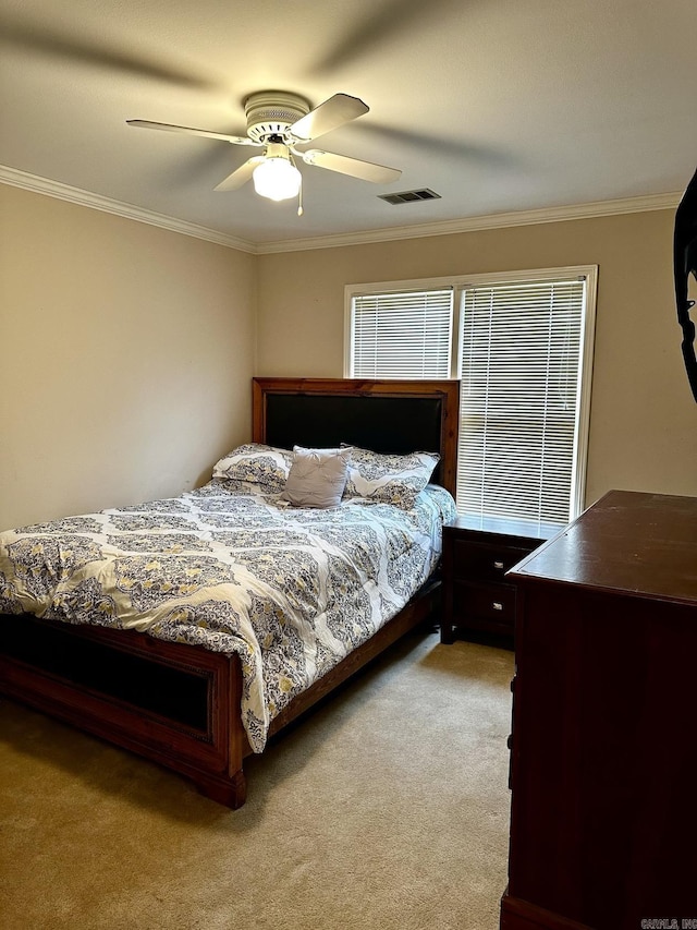 bedroom with light carpet, crown molding, and ceiling fan