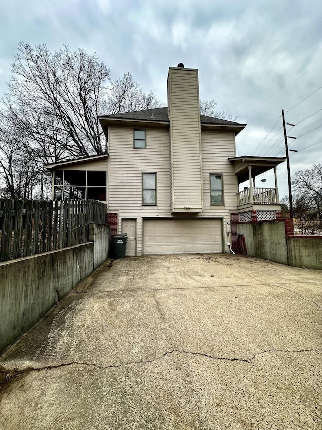 back of property featuring a garage