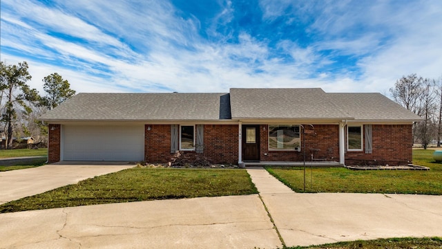 single story home with a front yard and a garage