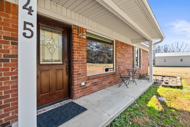 doorway to property featuring covered porch