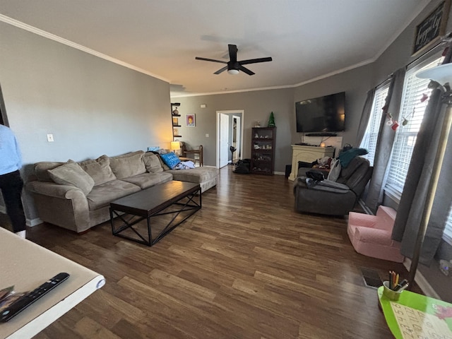 living room with ceiling fan, ornamental molding, and dark hardwood / wood-style floors