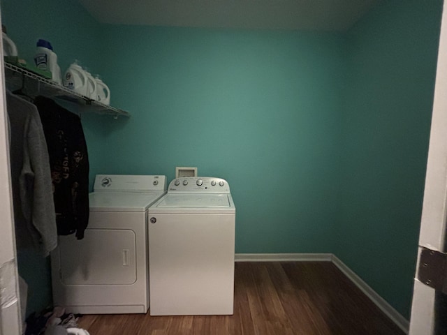 laundry area with hardwood / wood-style floors and washer and clothes dryer