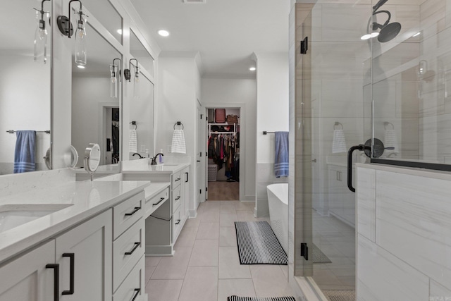 bathroom featuring crown molding, independent shower and bath, tile patterned flooring, and vanity