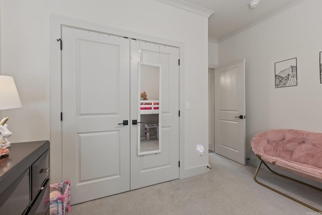 living area with light carpet and crown molding