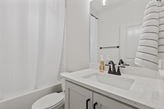 full bathroom featuring vanity, shower / tub combo with curtain, and toilet