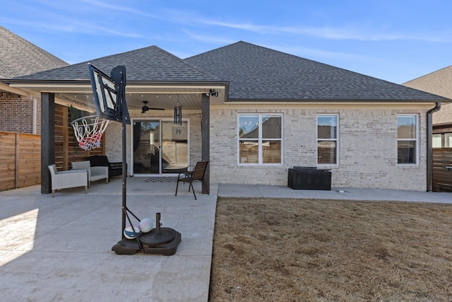 rear view of property with a patio, a lawn, and ceiling fan