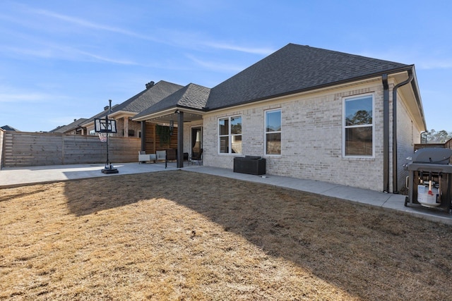 rear view of house with a patio