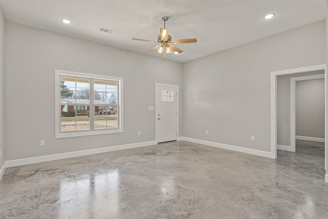 empty room with concrete flooring and ceiling fan