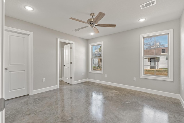 unfurnished bedroom featuring multiple windows and ceiling fan