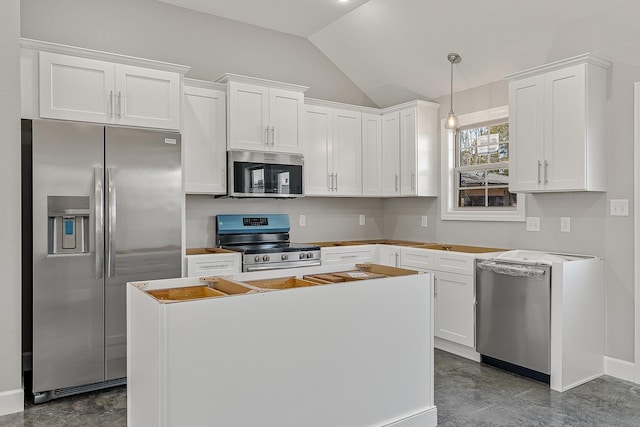 kitchen featuring white cabinets, appliances with stainless steel finishes, and pendant lighting