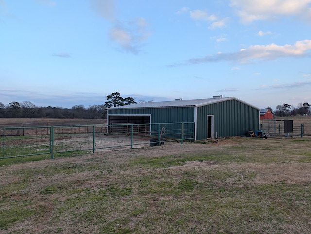 view of outdoor structure featuring a rural view