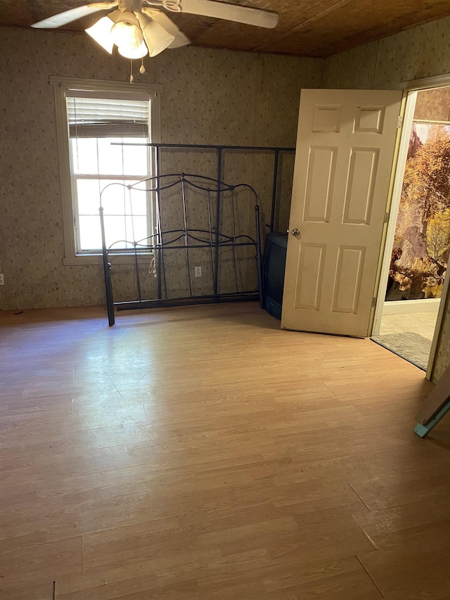 interior space with ceiling fan and light hardwood / wood-style floors