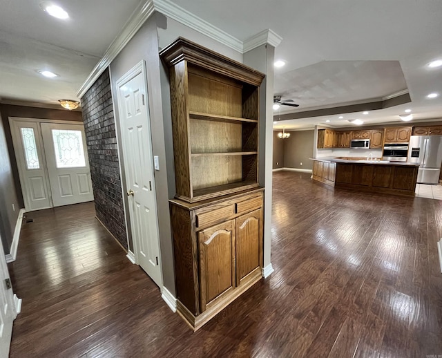 interior space featuring crown molding and dark hardwood / wood-style floors