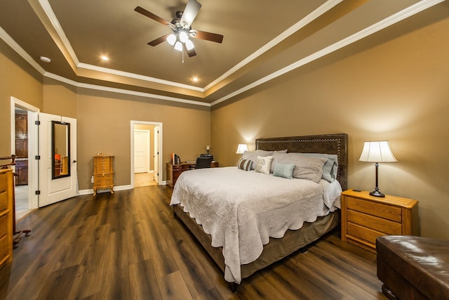 bedroom with a raised ceiling, ceiling fan, dark hardwood / wood-style floors, and ornamental molding