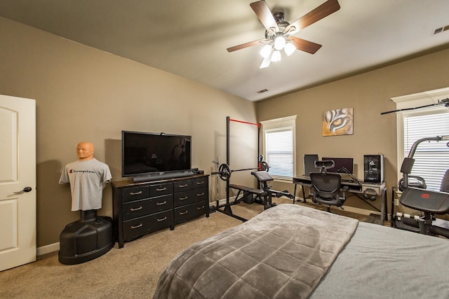 carpeted bedroom with ceiling fan