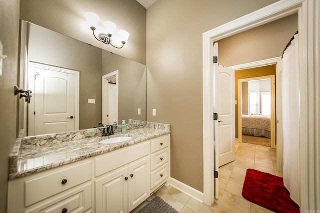 bathroom featuring tile patterned flooring and vanity