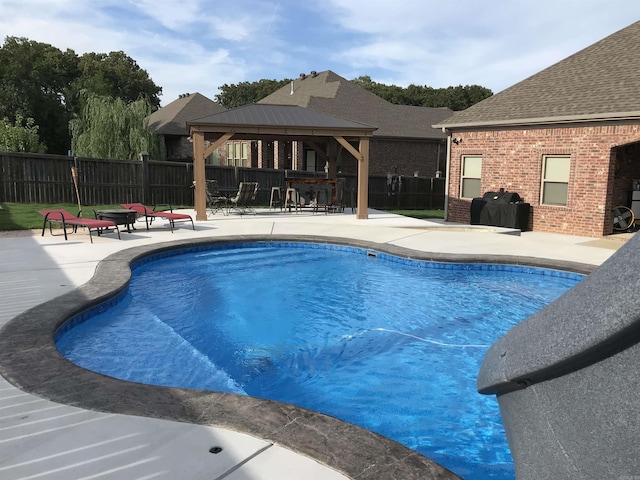view of pool with a gazebo, fence, a patio, and a fenced in pool