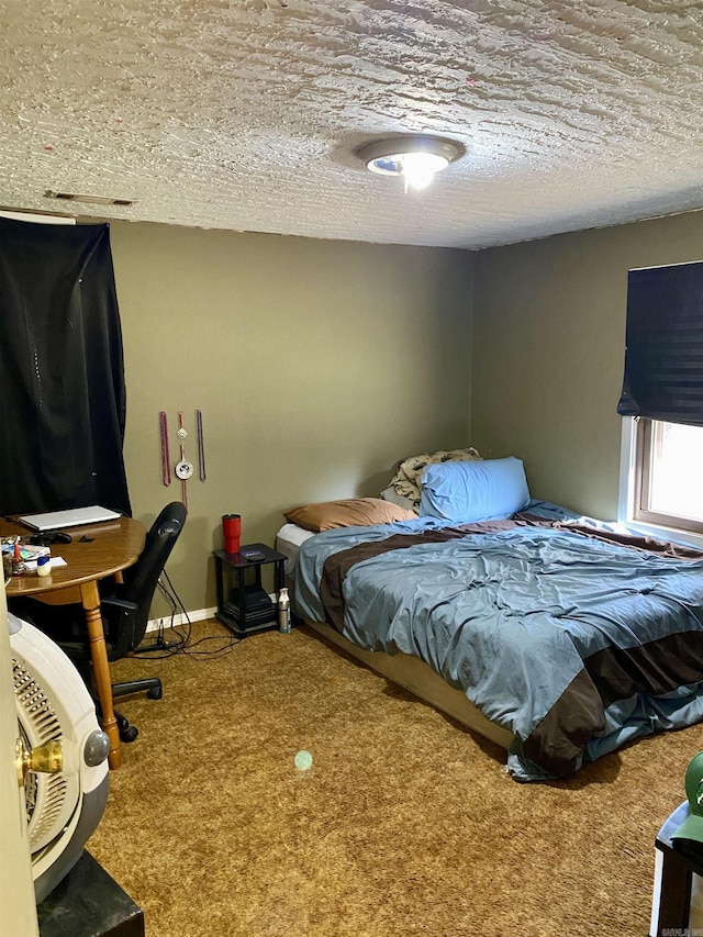 carpeted bedroom with a textured ceiling