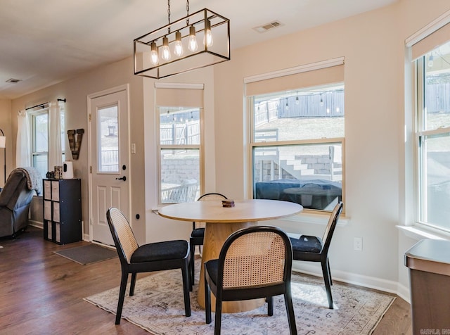 dining area with wood-type flooring